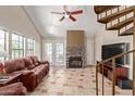 Living room with spiral staircase, fireplace, and tiled floors at 2333 E Southern Ave # 2041, Tempe, AZ 85282