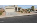 House exterior showcasing a front yard with landscaping and a driveway at 29362 W Weldon Ave, Buckeye, AZ 85396