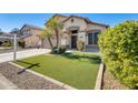 Two-story house with a two-car garage and artificial turf at 3610 N 106Th Ave, Avondale, AZ 85392