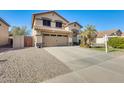 Two-story house with a two-car garage and landscaped front yard at 3610 N 106Th Ave, Avondale, AZ 85392