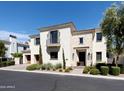 Stunning two-story home with stone accents and landscaped grounds at 3928 E Crittenden Ln, Phoenix, AZ 85018