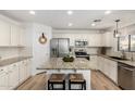 Modern kitchen featuring granite countertops, stainless steel appliances, and an island at 3984 E Los Altos Dr, Gilbert, AZ 85297