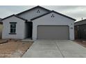 Charming single-story home featuring a two-car garage and a neutral color palette at 4145 E Kolin Ln, San Tan Valley, AZ 85143