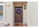 Inviting front entrance with a brown door and decorative wreath at 5018 E Siesta Dr # 3, Phoenix, AZ 85044