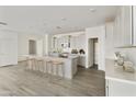 Modern kitchen with white shaker cabinets, quartz countertops, and an island at 5018 W Walatowa St, Laveen, AZ 85339