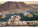 Bird's-eye view of community with lake and mountain backdrop at 5287 W Quail Ave, Glendale, AZ 85308