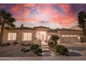 Stunning desert home with a beautiful landscape at sunset at 5287 W Quail Ave, Glendale, AZ 85308