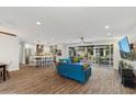 Open concept living room and kitchen with sliding doors to backyard at 5960 E Pershing Ave, Scottsdale, AZ 85254