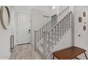 Bright entryway with staircase, wood-look tile floor, and a bench at 646 S Jacana Ln, Gilbert, AZ 85296