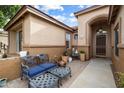 Inviting front patio with seating area, perfect for relaxing and enjoying the outdoors at 7167 W Trails Dr, Glendale, AZ 85308