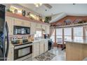 Bright kitchen featuring stainless steel appliances and ample cabinet space at 7750 E Broadway Rd # 584, Mesa, AZ 85208