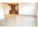 Dining area with built-in hutch and tile flooring at 9655 E Edgewood Ave, Mesa, AZ 85208