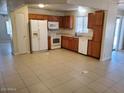 Bright kitchen with ample cabinetry and tile flooring at 9655 E Edgewood Ave, Mesa, AZ 85208