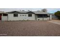 Cute ranch home with rock landscaping at 1022 S Lola Ln, Tempe, AZ 85281