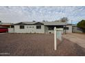 Charming single story home with front yard at 1022 S Lola Ln, Tempe, AZ 85281