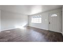 Bright living room featuring hardwood floors and lots of natural light at 1022 S Lola Ln, Tempe, AZ 85281