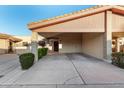 Single level home with carport and mature shrubs at 12017 N 27Th Pl, Phoenix, AZ 85028