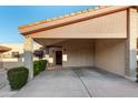 Front view of a condo with carport and landscaping at 12017 N 27Th Pl, Phoenix, AZ 85028