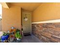 Inviting front entrance with stonework, potted plants, and a welcome mat at 1333 N Balboa --, Mesa, AZ 85205