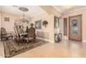 Elegant dining room features ornate chairs and a large area rug at 1534 E Sweet Citrus Dr, Queen Creek, AZ 85140