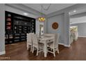 Bright dining area with a white table and built-in shelving at 1570 W Bartlett Way, Chandler, AZ 85248