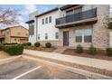 Modern two-story home with stone accents and a balcony at 1685 S Wallrade Ln, Gilbert, AZ 85295