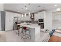 Spacious kitchen featuring white cabinets and a large island at 1685 S Wallrade Ln, Gilbert, AZ 85295