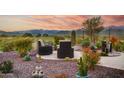 Backyard patio with mountain views and desert landscaping at 17676 E Woolsey Way, Rio Verde, AZ 85263