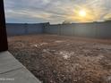 Empty lot with block wall and mountain views at 19008 W Stella Ave, Waddell, AZ 85355