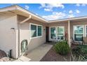 Home's exterior features a walkway, landscaping, and a small patio with seating at 19019 N Camino Del Sol --, Sun City West, AZ 85375