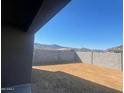 Landscaped backyard with mountain views and block wall at 19026 W Stella Ave, Waddell, AZ 85355