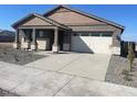 New construction home with neutral color scheme and a driveway at 19026 W Stella Ave, Waddell, AZ 85355