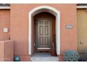 Inviting front entrance with arched entryway and tasteful landscaping at 240 W Juniper Ave # 1173, Gilbert, AZ 85233