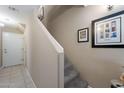 Interior view of staircase with wall decor leading to upper level at 240 W Juniper Ave # 1173, Gilbert, AZ 85233