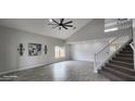 Spacious living room with vaulted ceiling, and gray tile floors at 2463 W Morning Sun Cir, San Tan Valley, AZ 85144