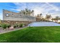 Sun City Festival entrance with water feature and landscaping at 26448 W Kimberly Way, Buckeye, AZ 85396