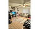 Spacious living room featuring tiled floors and plenty of natural light at 2645 W Wolf St, Phoenix, AZ 85017