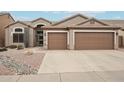 Single-story home with a two-car garage and desert landscaping at 26616 N 42Nd Way, Cave Creek, AZ 85331