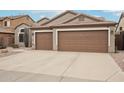 Two-car garage and front yard with gravel at 26616 N 42Nd Way, Cave Creek, AZ 85331