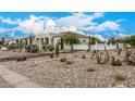 Landscaped front yard with desert plants and rock at 34083 N Paseo Grande Dr, Queen Creek, AZ 85144