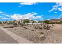 Landscaped front yard with desert plants and rock at 34083 N Paseo Grande Dr, Queen Creek, AZ 85144