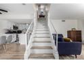 Modern staircase with kitchen and living room views at 3511 E Baseline Rd # 1203, Phoenix, AZ 85042