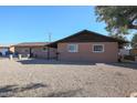 Ranch style home with a gravel front yard and a tree at 4131 N 55Th Dr, Phoenix, AZ 85031