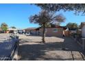 Ranch style home with a gravel front yard and a tree at 4131 N 55Th Dr, Phoenix, AZ 85031