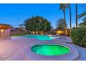 Relaxing pool and spa area with lush landscaping at 437 E Marconi Ave, Phoenix, AZ 85022