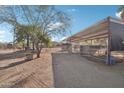 Covered stalls and corral area providing ample space for horses at 47435 N Meander Rd, New River, AZ 85087