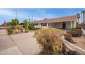 House exterior showcasing a carport and well-manicured yard at 501 W Linda Ln, Chandler, AZ 85225