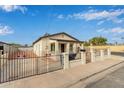 Charming bungalow with a gated front yard and driveway at 562 N Lewis --, Mesa, AZ 85201