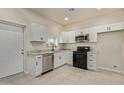 Modern kitchen featuring white shaker cabinets and granite countertops at 562 N Lewis --, Mesa, AZ 85201