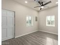 Bright and airy living room with hardwood floors and ceiling fan at 562 N Lewis --, Mesa, AZ 85201